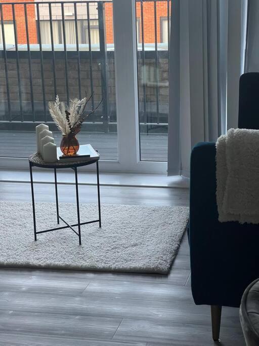 a living room with a table with a pumpkin on it at Stylish Luxury new 2 bedroom Apartment in Dartford