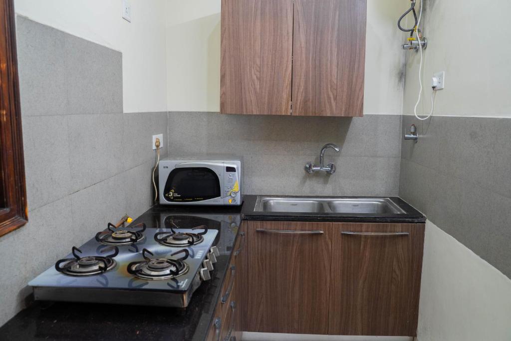 Kuchyň nebo kuchyňský kout v ubytování PerfectStayz Shimla