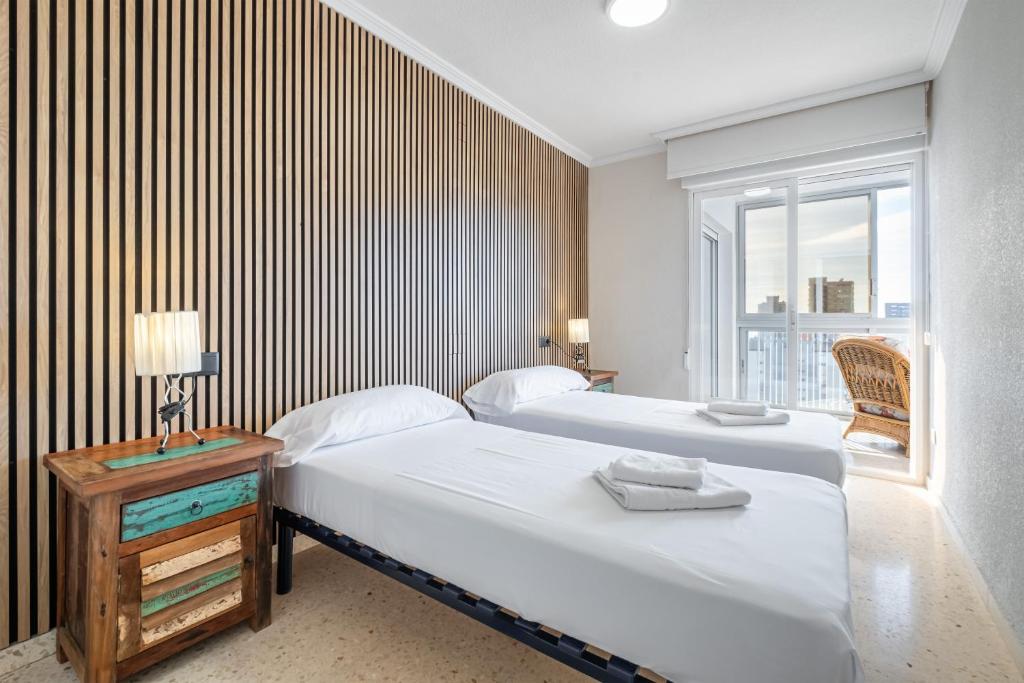 A bed or beds in a room at Alteanos 16-2 Apartment Levante Beach