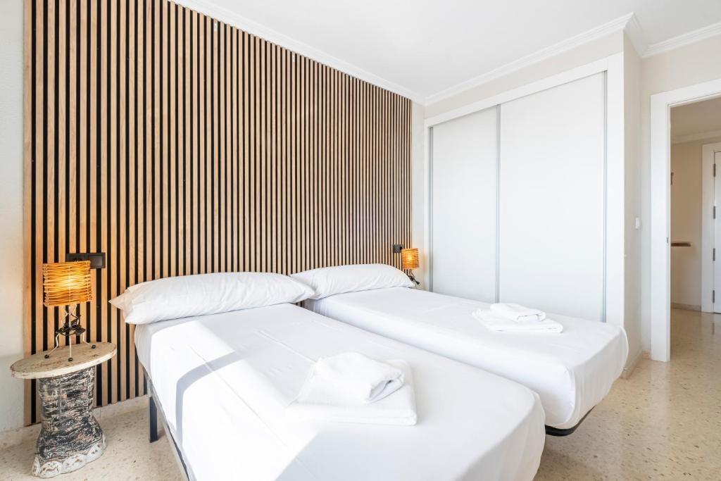 A bed or beds in a room at Alteanos 16-2 Apartment Levante Beach