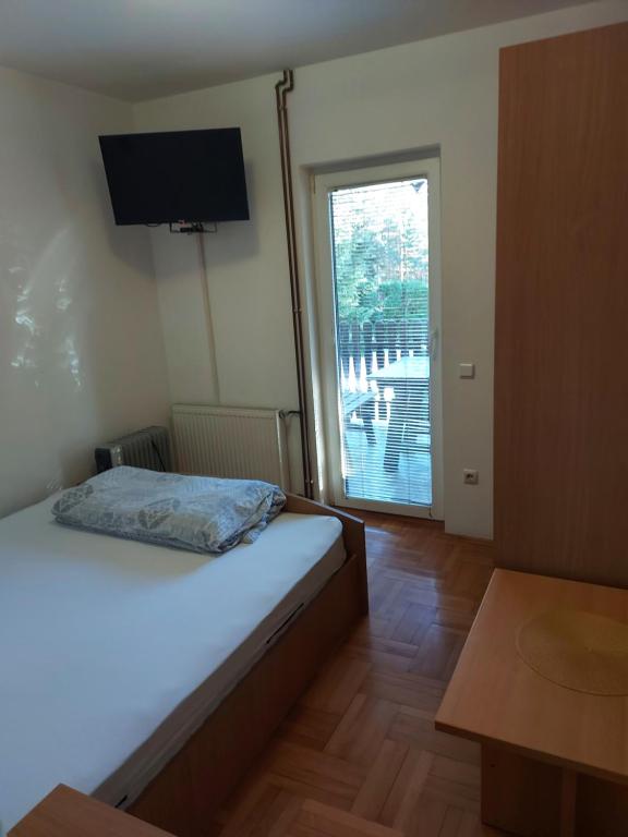 Postel nebo postele na pokoji v ubytování Apartmani vila Todor