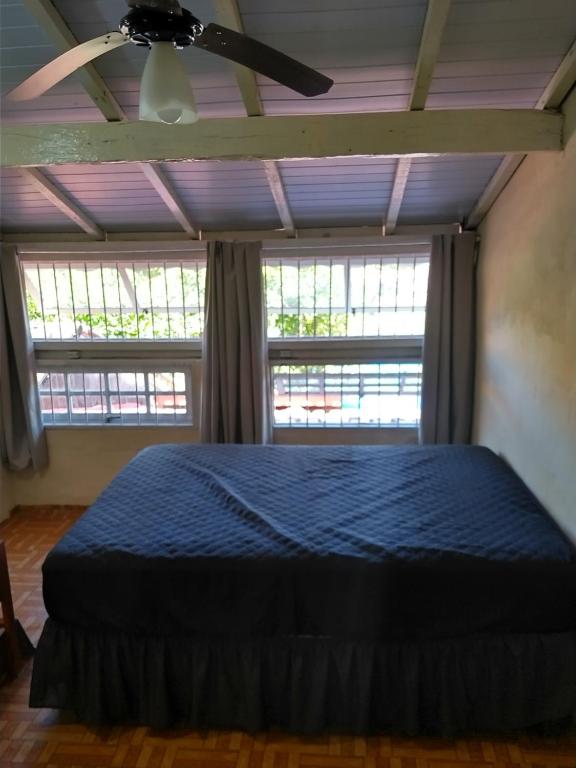 Tempat tidur dalam kamar di Praia de Boraceia casa 2 Bertioga