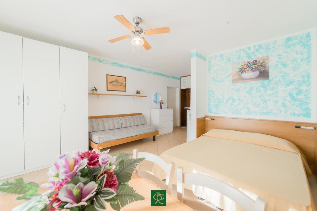 A bed or beds in a room at Residence Baia di Norsi