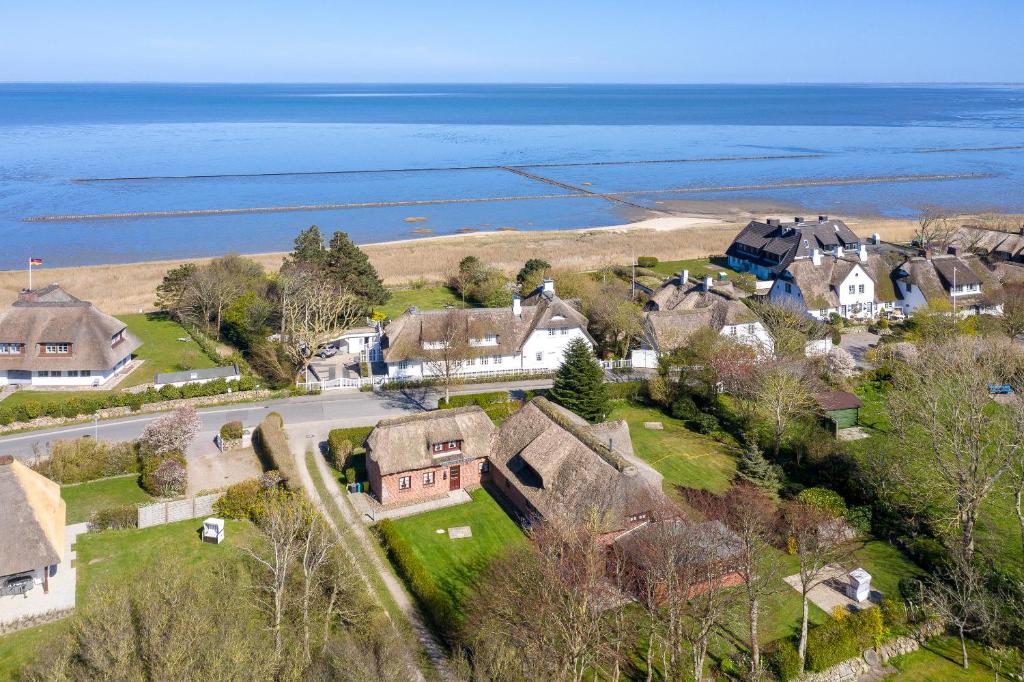 an aerial view of a houses and the ocean at Huldas Hues in Keitum