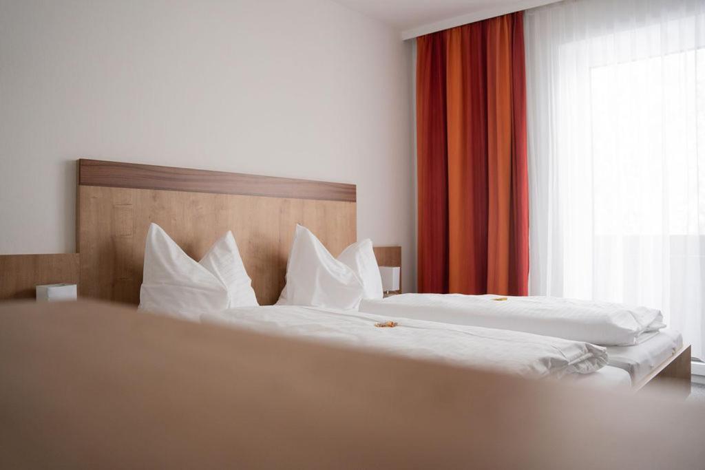 Postel nebo postele na pokoji v ubytování Frühstückspension Auer - Haus Kargl