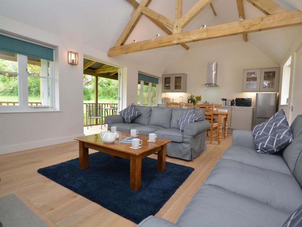 a living room with couches and a coffee table at 2 bed in Sherborne 80735 in Wootton Glanville