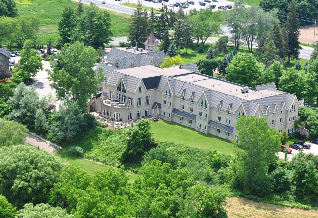 an aerial view of a large building on a hill at Elmhurst Inn & Spa in Ingersoll
