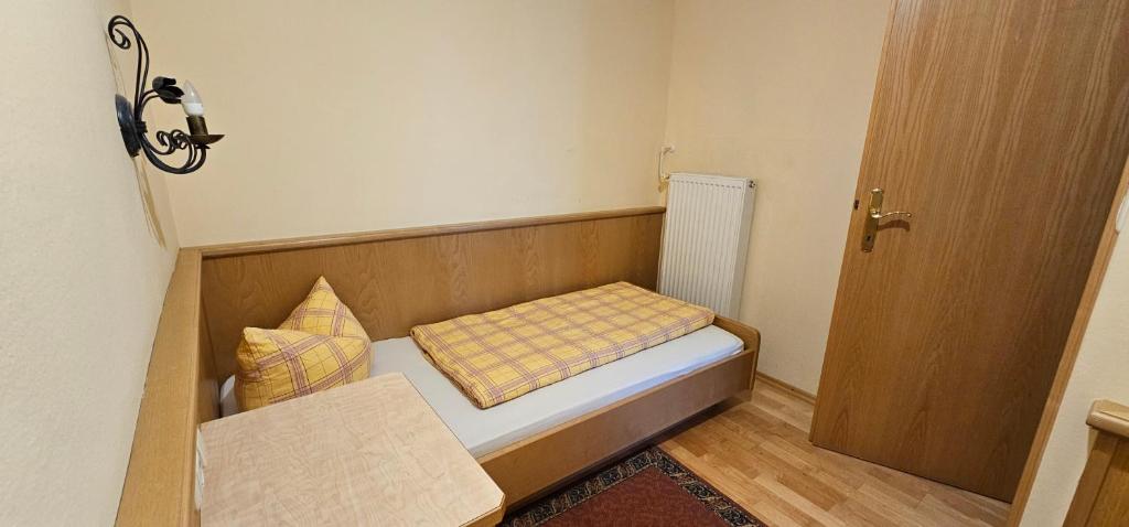Postel nebo postele na pokoji v ubytování Hotel-Garni Pramstraller