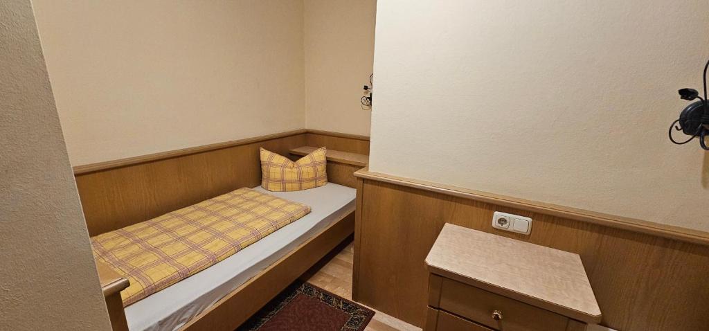 Postel nebo postele na pokoji v ubytování Hotel-Garni Pramstraller