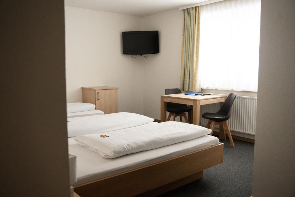 Postel nebo postele na pokoji v ubytování Frühstückspension Auer - Haus Kargl