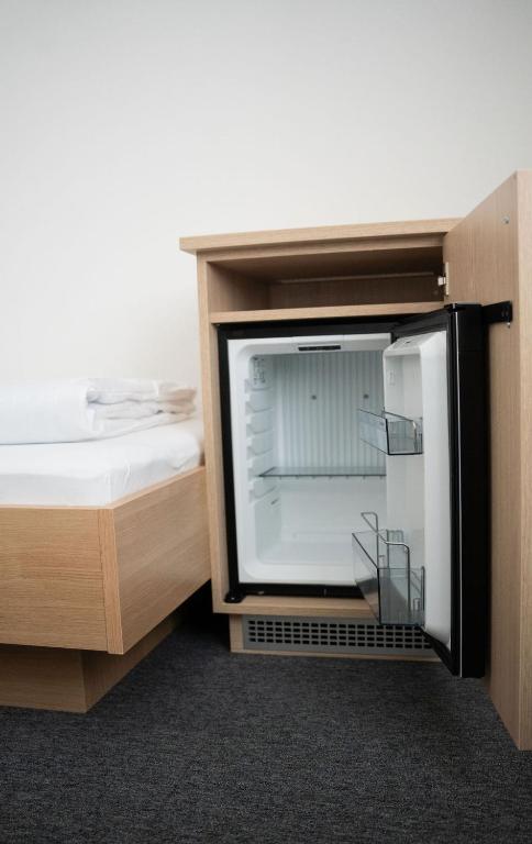 Postel nebo postele na pokoji v ubytování Frühstückspension Auer - Haus Kargl