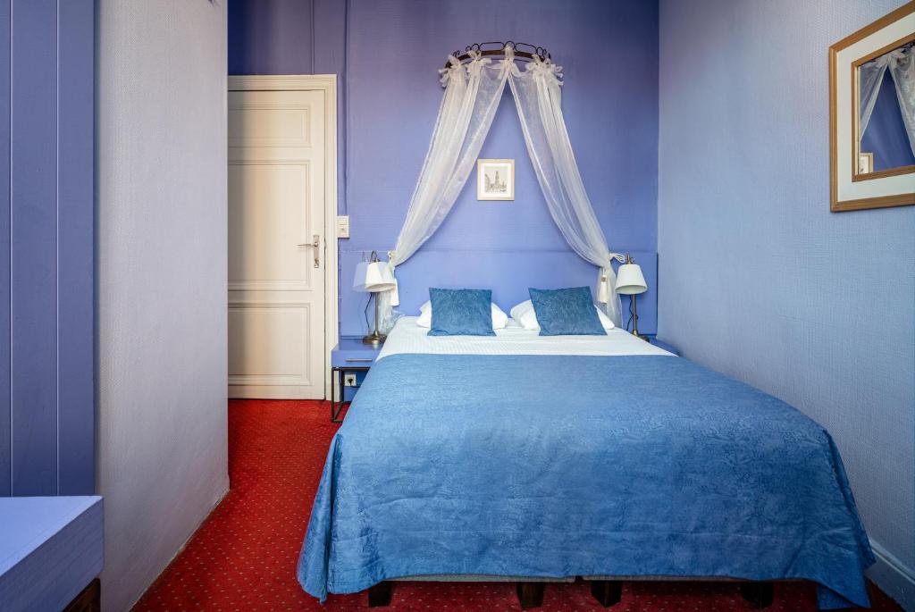 Postel nebo postele na pokoji v ubytování Hotel Van Eyck