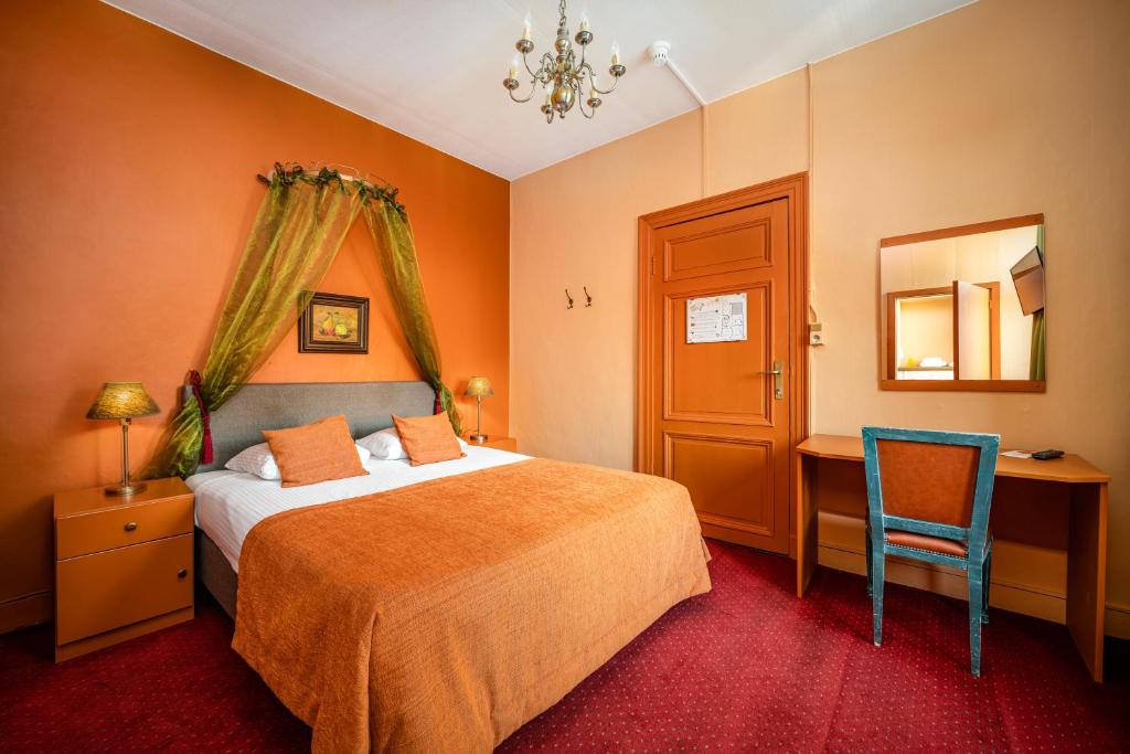 Postel nebo postele na pokoji v ubytování Hotel Van Eyck