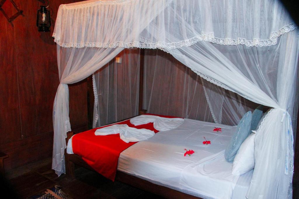 Postel nebo postele na pokoji v ubytování Kolon Resort Sigiriya