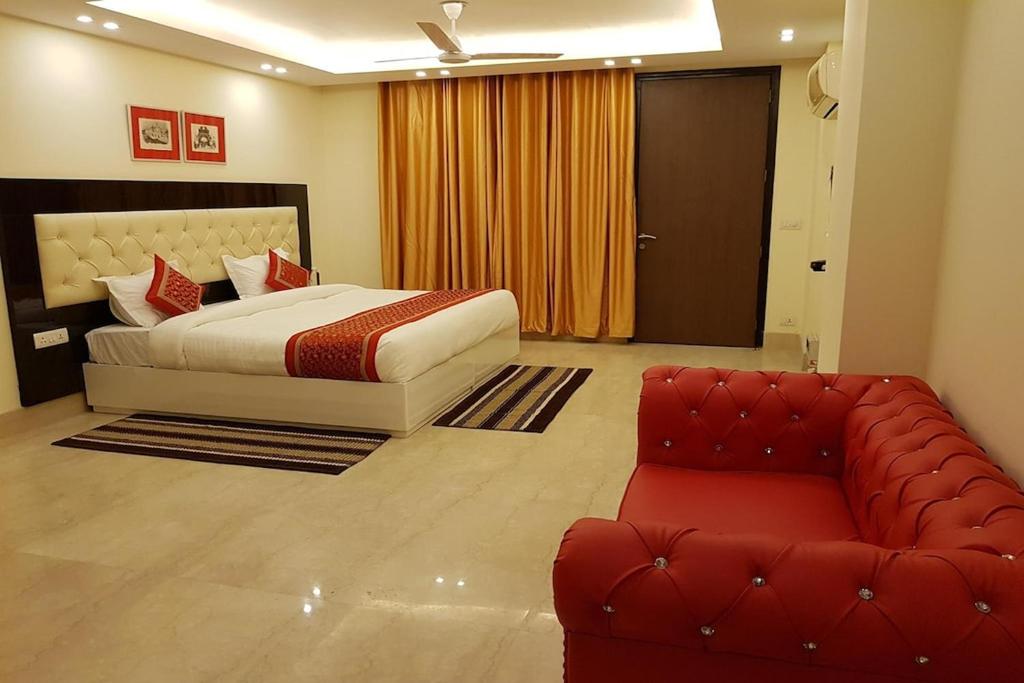 เตียงในห้องที่ Greenleaf Apartment and Suites, Kalkaji