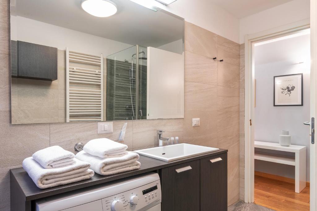 Posteľ alebo postele v izbe v ubytovaní easyhomes - Spiga Suite