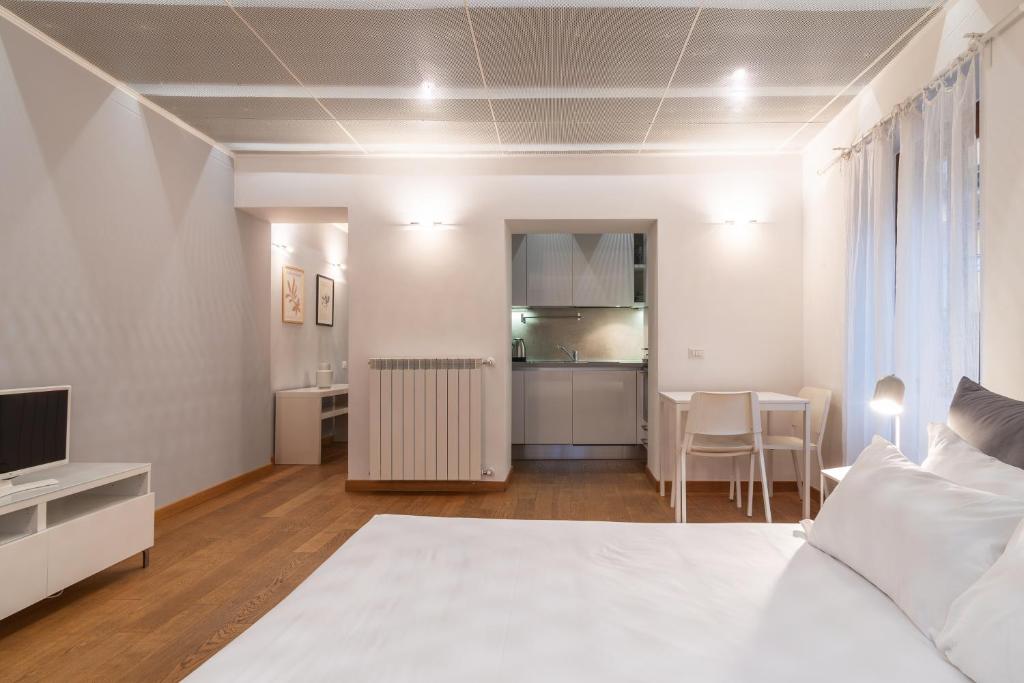 Posteľ alebo postele v izbe v ubytovaní easyhomes - Spiga Suite