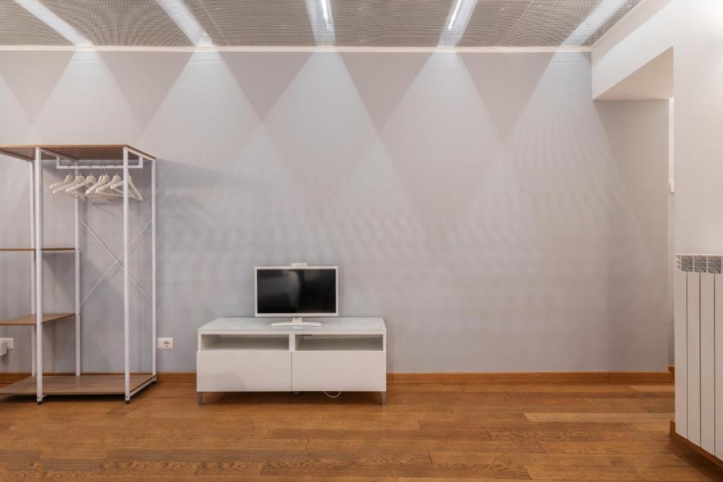 Televízia a/alebo spoločenská miestnosť v ubytovaní easyhomes - Spiga Suite