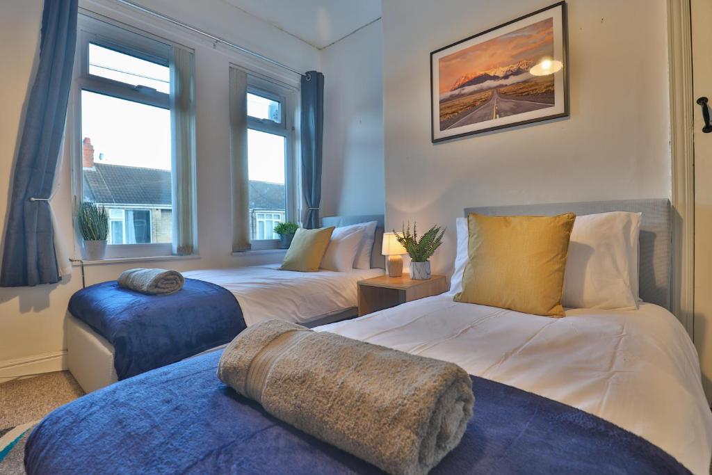 Katil atau katil-katil dalam bilik di Devon St - Cozy home, Free easy parking!