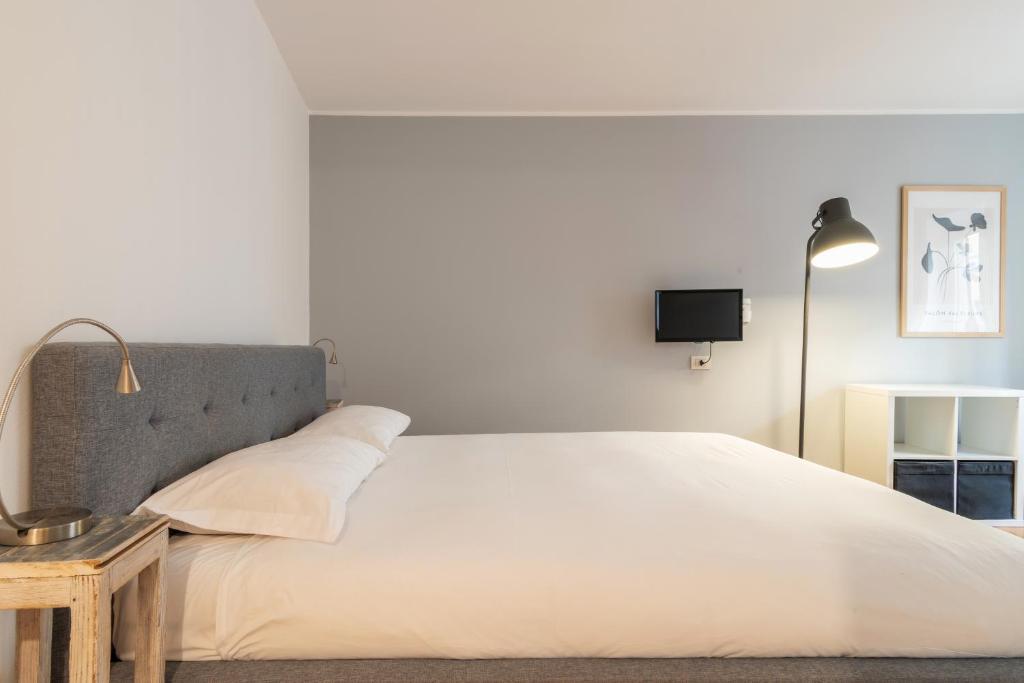 Posteľ alebo postele v izbe v ubytovaní easyhomes - Spiga Suite
