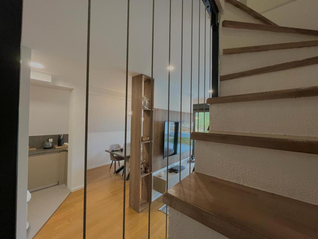 a room with a staircase with a glass wall at Villa Anemar in Blidinje