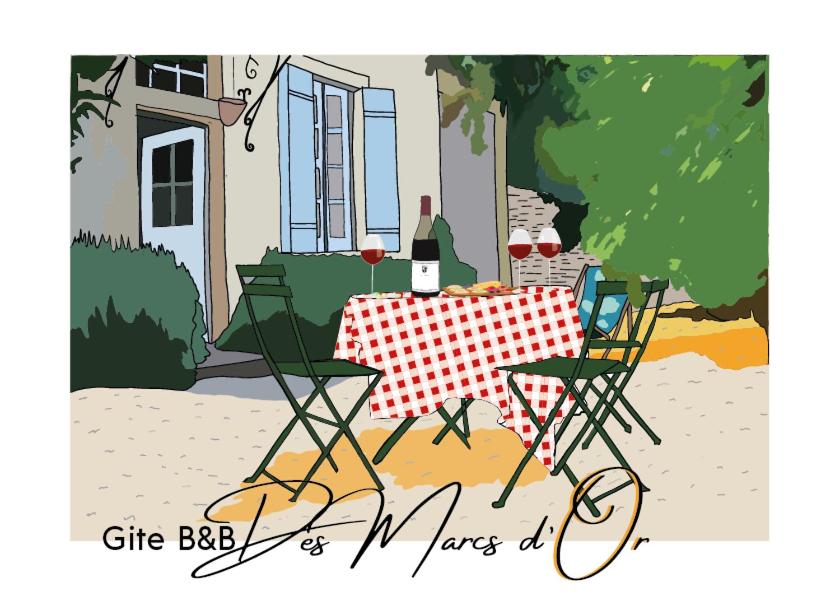 una mesa con 2 sillas y una botella de vino en B&B des Marcs d'Or en Dijon