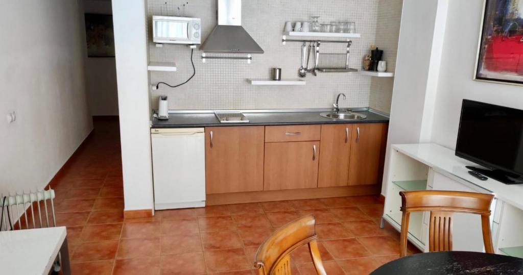 Kuchyňa alebo kuchynka v ubytovaní APARTAMENTOS SIERRA NEVADA VISTA SNOW