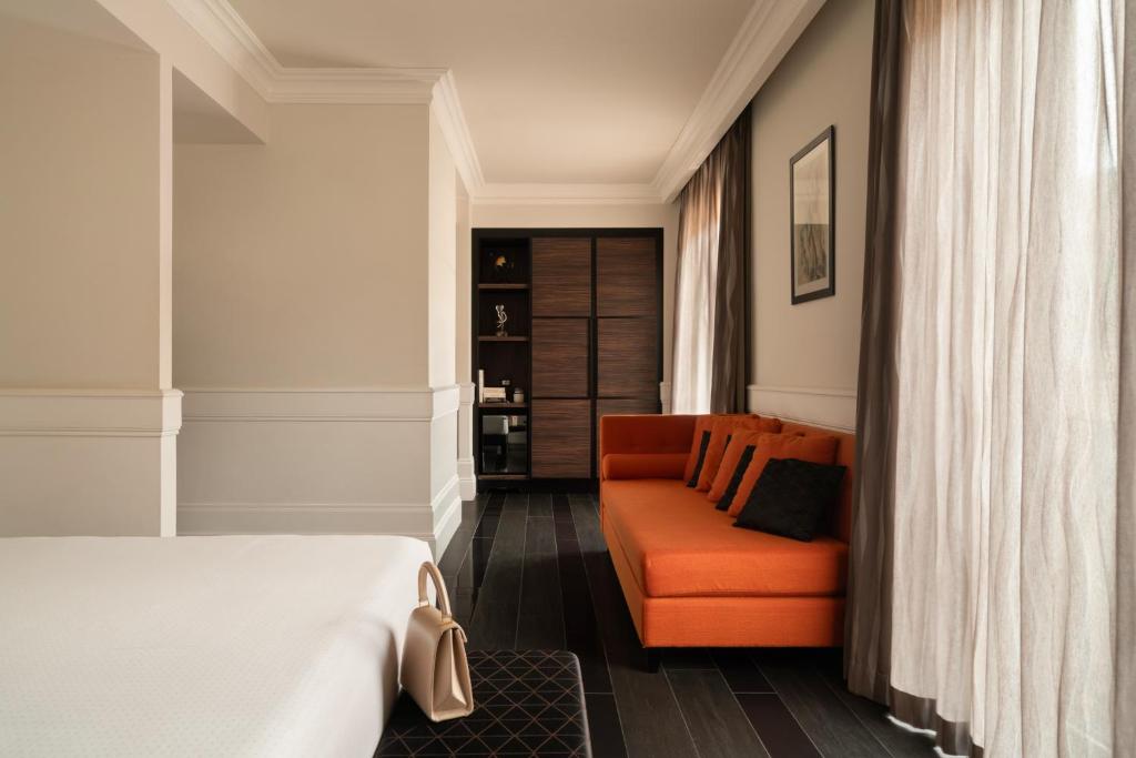 A bed or beds in a room at Palazzo Navona Hotel