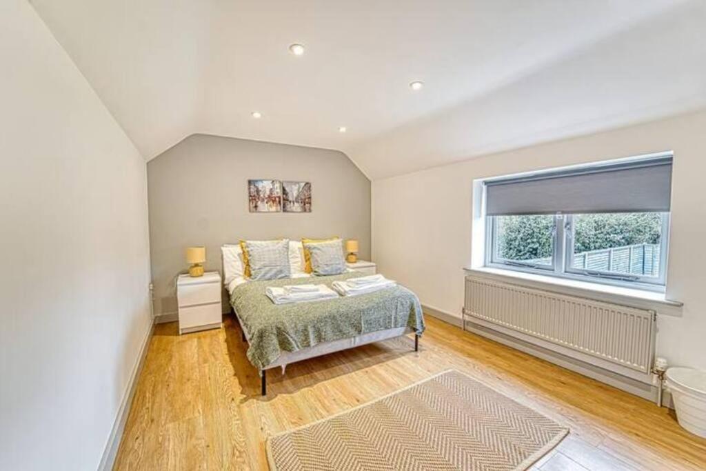 a bedroom with a bed and a window at Guest Homes - Bridge Street Dwelling in Leominster