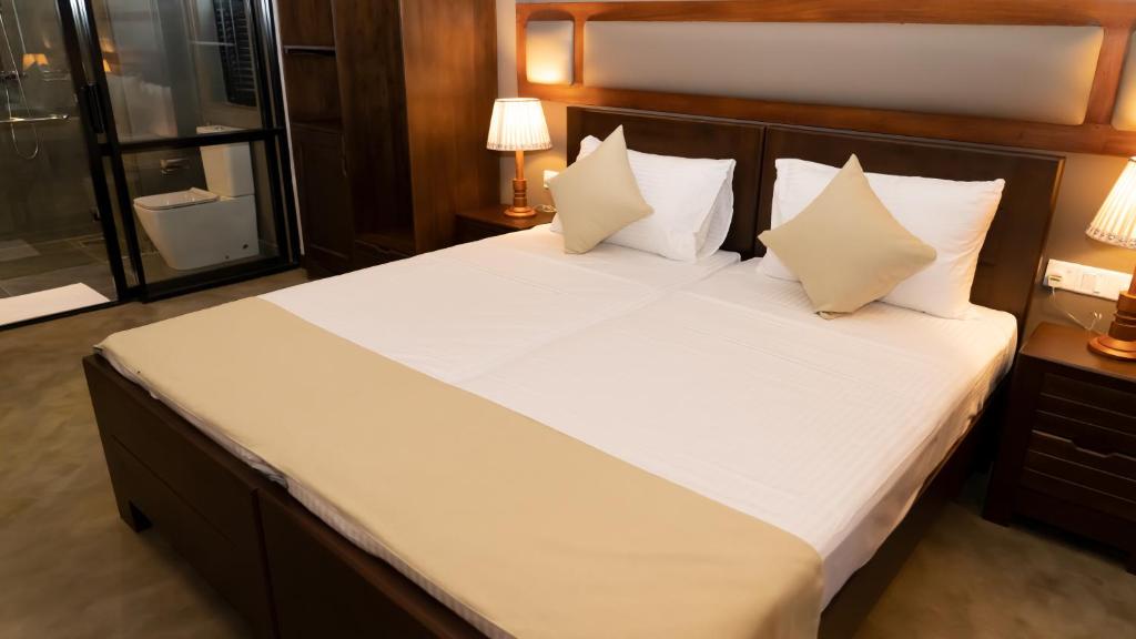 Postel nebo postele na pokoji v ubytování Woodgrove Cabanas