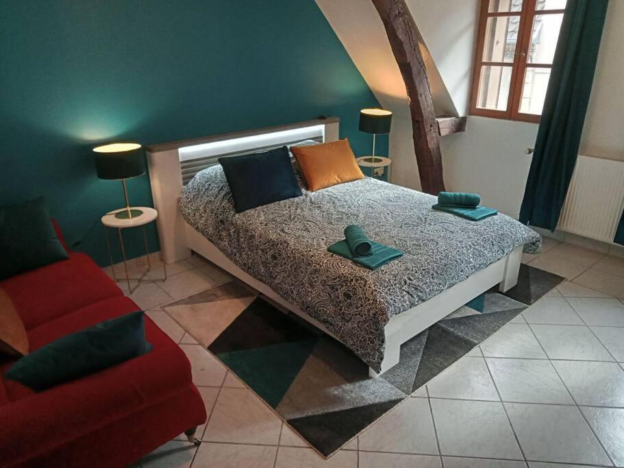 Una cama o camas en una habitaci&oacute;n de Splendide Moulins