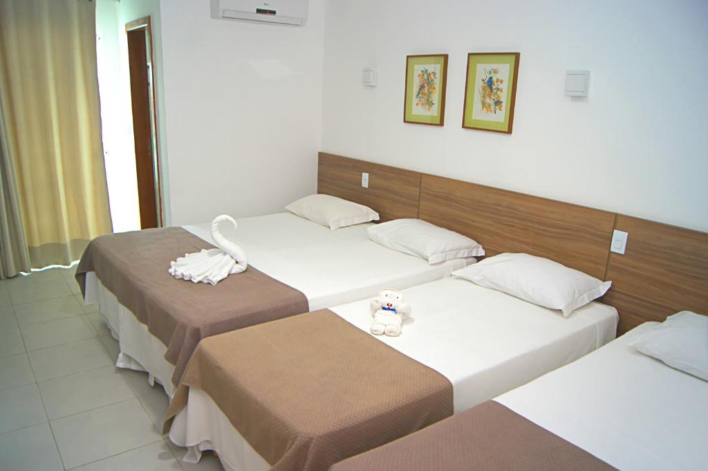 Postel nebo postele na pokoji v ubytování Hotel Flor Da Chapada