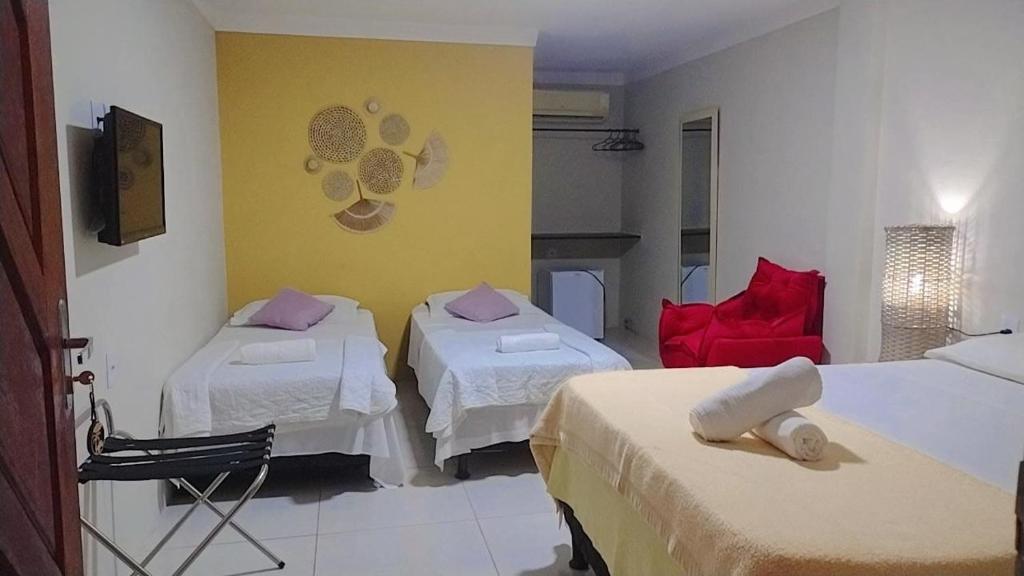 Ein Bett oder Betten in einem Zimmer der Unterkunft POUSADA GENIPABU PRAIA
