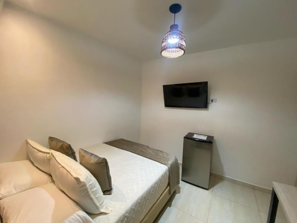 TV a/nebo společenská místnost v ubytování Maidy Luxury Hotel