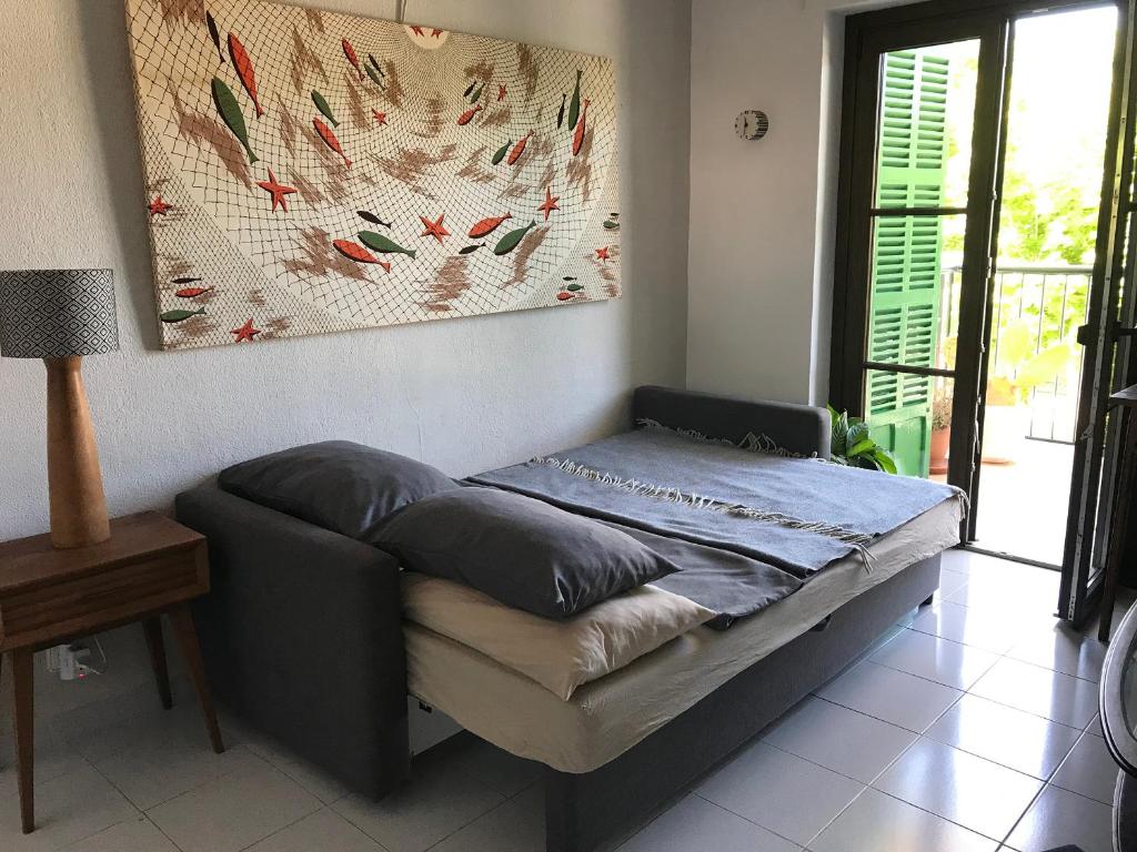 Postel nebo postele na pokoji v ubytování Seafront Apartment in Port Sóller
