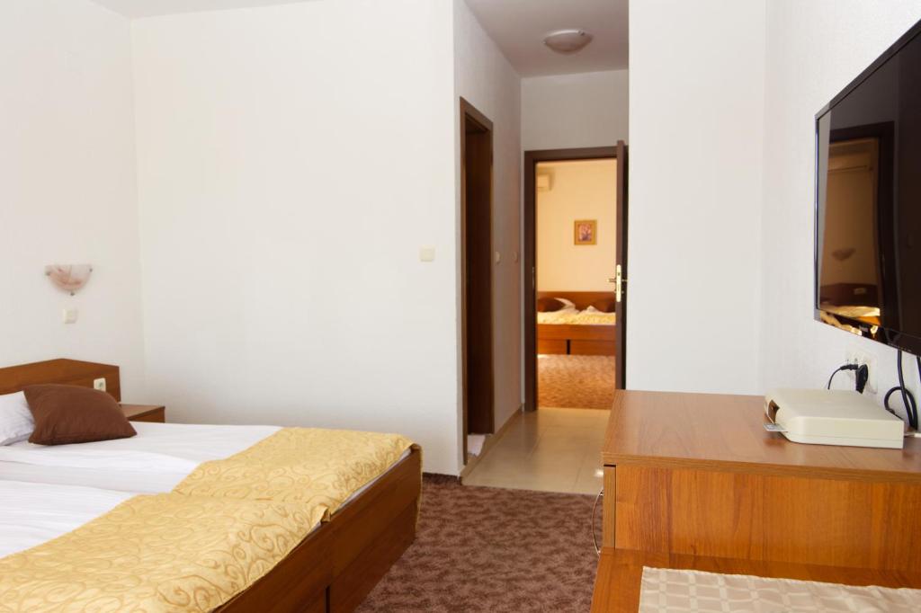 Postel nebo postele na pokoji v ubytování Hotel Genada