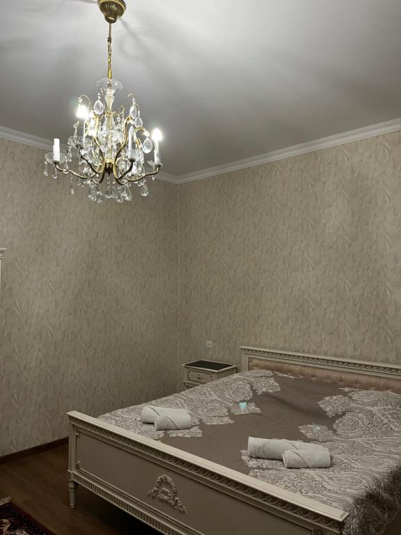 Postel nebo postele na pokoji v ubytování Lia Khaikashvili Guest House
