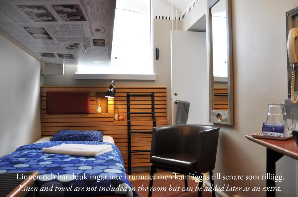 Ein Bett oder Betten in einem Zimmer der Unterkunft STF Långholmen Hostel