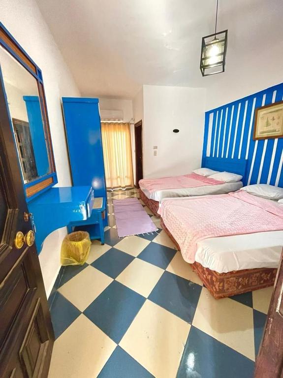 Postel nebo postele na pokoji v ubytování Dahab Vibes Hotel