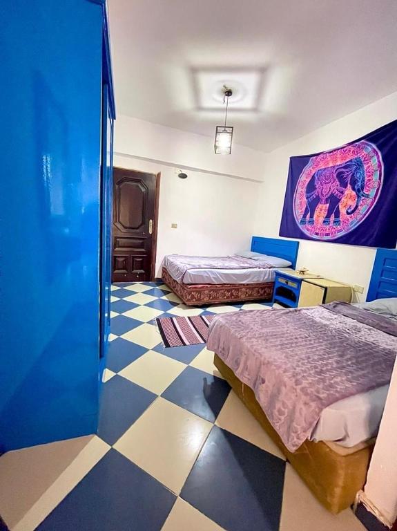 Postel nebo postele na pokoji v ubytování Dahab Vibes Hotel