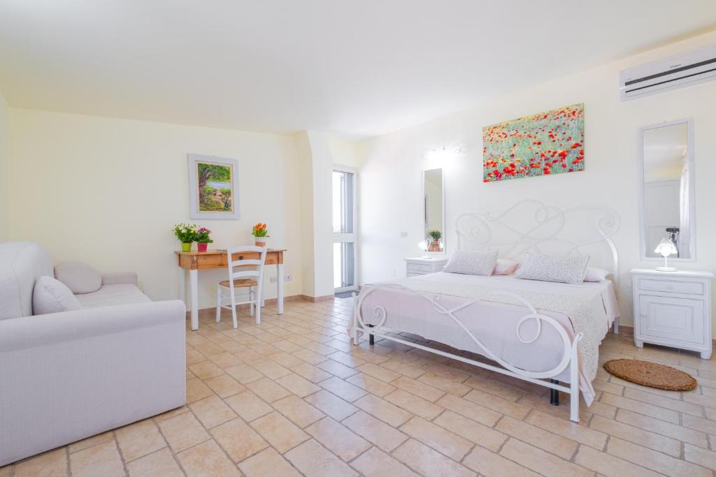 Postel nebo postele na pokoji v ubytování Villa VentoSolare Luxury - Specchia