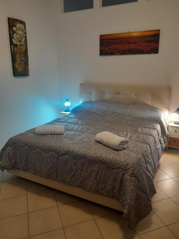Postel nebo postele na pokoji v ubytování Sotto il Castello