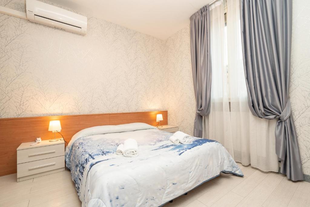Postel nebo postele na pokoji v ubytování Hotel Donatello