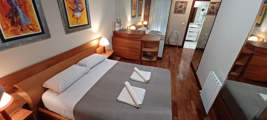 Postel nebo postele na pokoji v ubytování Apartamento céntrico con vistas a la Ría! garaje, ideal 2-4
