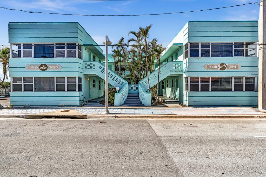 a blue building with a staircase in front of it at Coastal Sunset in Hollywood