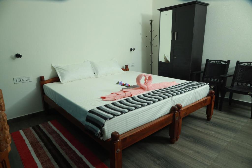 Postel nebo postele na pokoji v ubytování Marari Sophy Villa