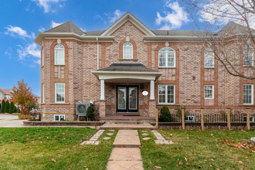 a large brick house with a front door at 4-BR Family Haven - Near Wonderland and Vaughan Mills in Vaughan