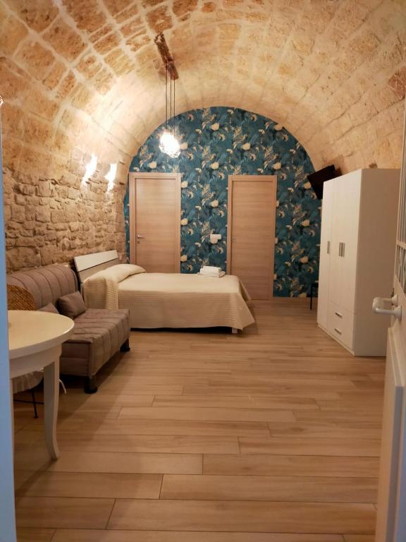 Postel nebo postele na pokoji v ubytování Vicolo degli Archi