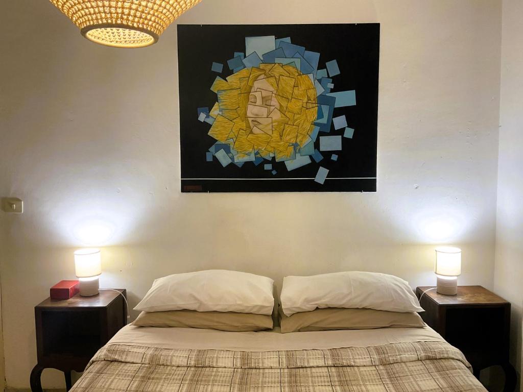 En eller flere senge i et værelse på La Terrazza Verde