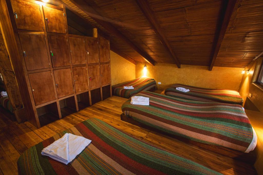 Postel nebo postele na pokoji v ubytování Llullu Llama Mountain Lodge